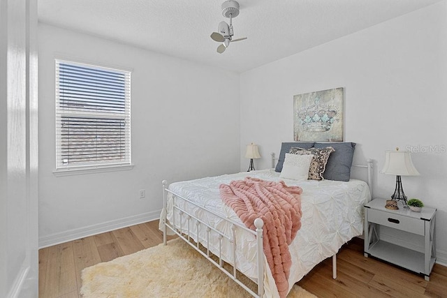 14897 Ellingsworth Ln, Winter Garden, FL 34787 - bedroom featuring wood finished floors and baseboards