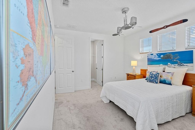 14897 Ellingsworth Ln, Winter Garden, FL 34787 - carpeted bedroom featuring a textured ceiling and ceiling fan