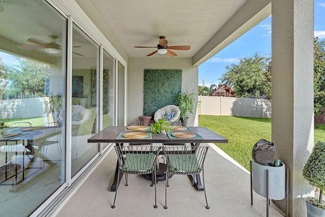 14897 Ellingsworth Ln, Winter Garden, FL 34787 - fenced backyard with ceiling fan, outdoor dining space, and a patio area