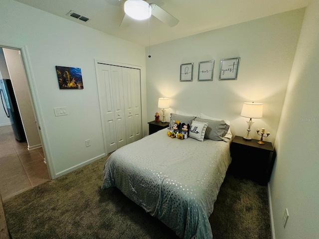 439 Cool Summer Ln, Davenport, FL 33837 - carpeted bedroom with a closet, ceiling fan, and tile patterned flooring