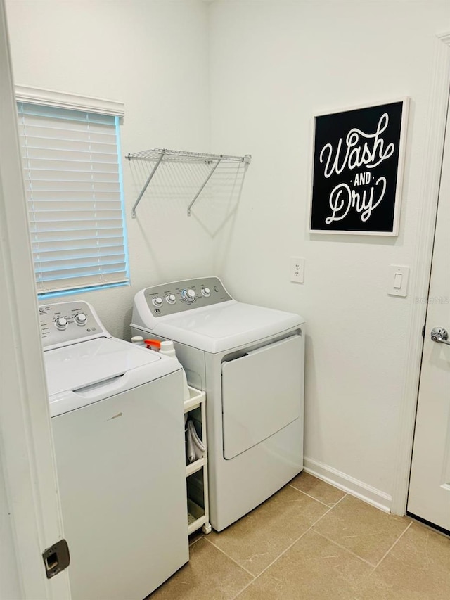 439 Cool Summer Ln, Davenport, FL 33837 - washroom featuring washing machine and dryer and light tile patterned floors