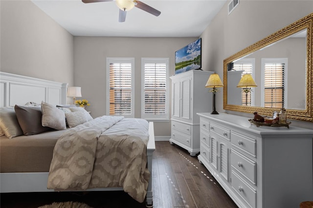 501 Mirasol Cir Unit 304, Kissimmee, FL 34747 - bedroom with multiple windows, dark wood-style flooring, and a ceiling fan