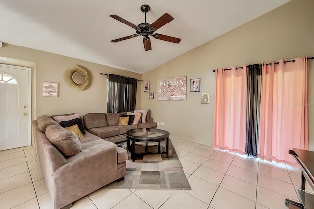 2242 Atrium Cir, Orlando, FL 32808 - living area with vaulted ceiling, a ceiling fan, and light tile patterned floors