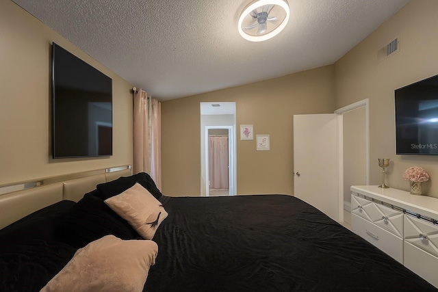 2242 Atrium Cir, Orlando, FL 32808 - bedroom with vaulted ceiling and a textured ceiling