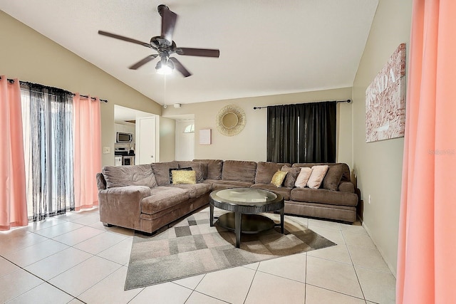 2242 Atrium Cir, Orlando, FL 32808 - living room with lofted ceiling, a ceiling fan, and light tile patterned floors