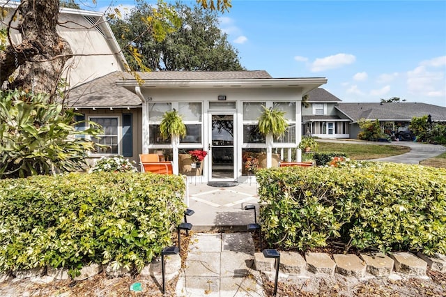 1339 Villa Ln Unit 50, Apopka, FL 32712 - doorway to property featuring a shingled roof