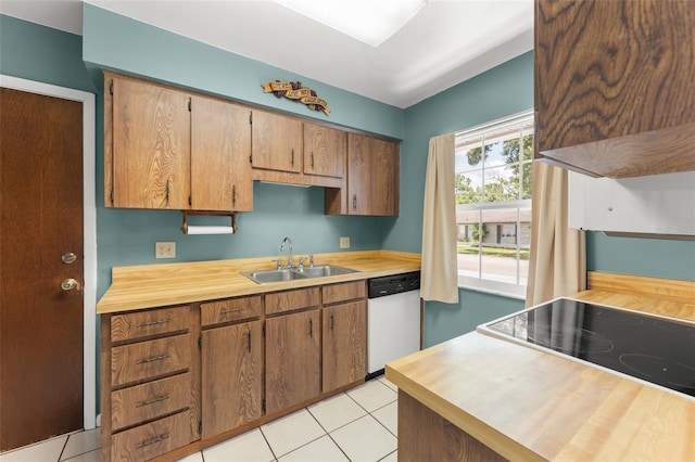 17 Rosewood Dr, Davenport, FL 33837 - kitchen with dishwasher, butcher block counters, light tile patterned floors, and black electric stovetop