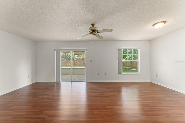 17 Rosewood Dr, Davenport, FL 33837 - spare room with plenty of natural light, a ceiling fan, wood finished floors, and a textured ceiling