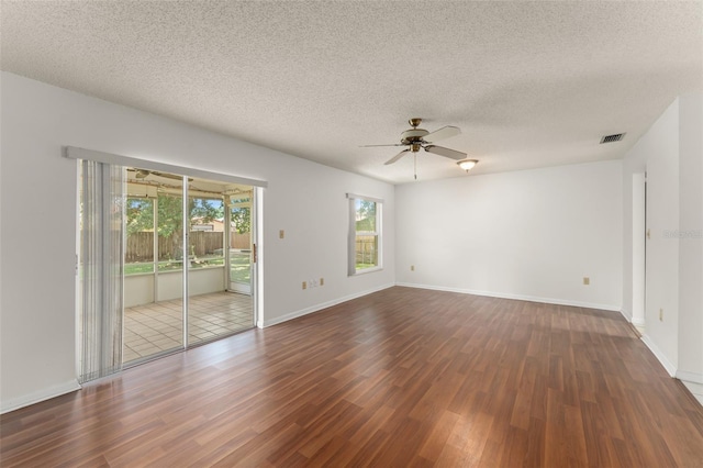 17 Rosewood Dr, Davenport, FL 33837 - unfurnished room with dark wood-style flooring, ceiling fan, and a textured ceiling