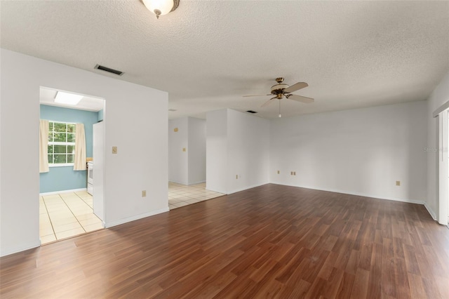 17 Rosewood Dr, Davenport, FL 33837 - unfurnished room featuring wood finished floors, ceiling fan, and a textured ceiling