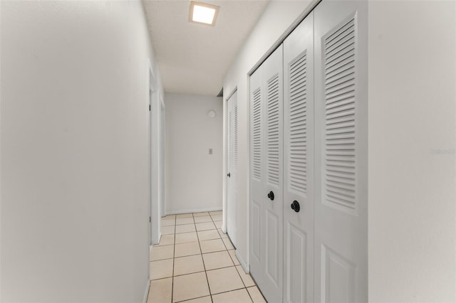 17 Rosewood Dr, Davenport, FL 33837 - hallway featuring light tile patterned floors