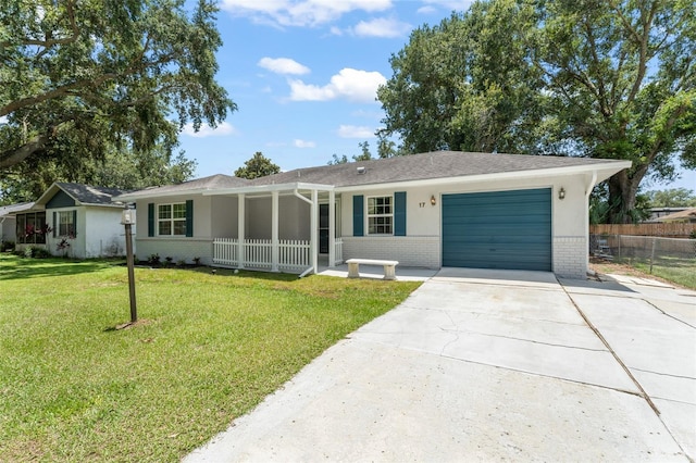 17 Rosewood Dr, Davenport, FL 33837 - ranch-style house with brick siding, a garage, driveway, and a porch