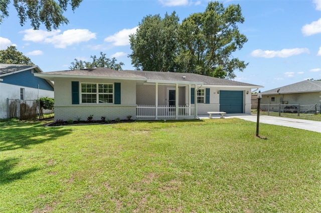 17 Rosewood Dr, Davenport, FL 33837 - single story home with driveway, brick siding, a garage, stucco siding, and a porch