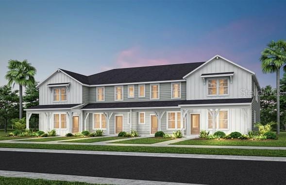 2304 Southbury Dr, Kissimmee, FL 34744 - modern farmhouse style home featuring board and batten siding and a front yard