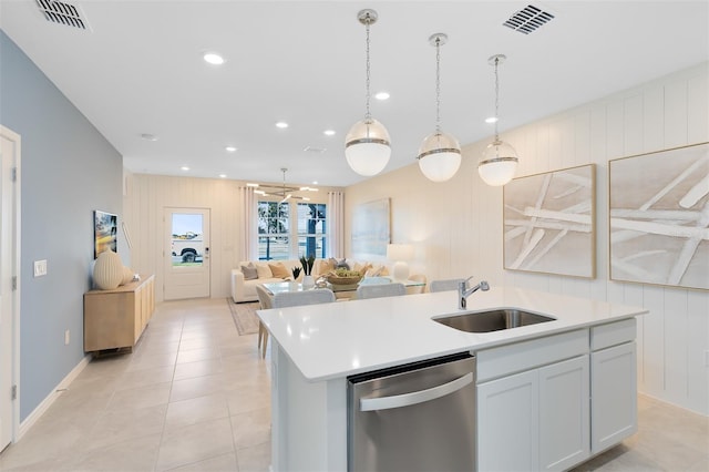 2304 Southbury Dr, Kissimmee, FL 34744 - kitchen featuring dishwasher, an island with sink, open floor plan, light countertops, and recessed lighting