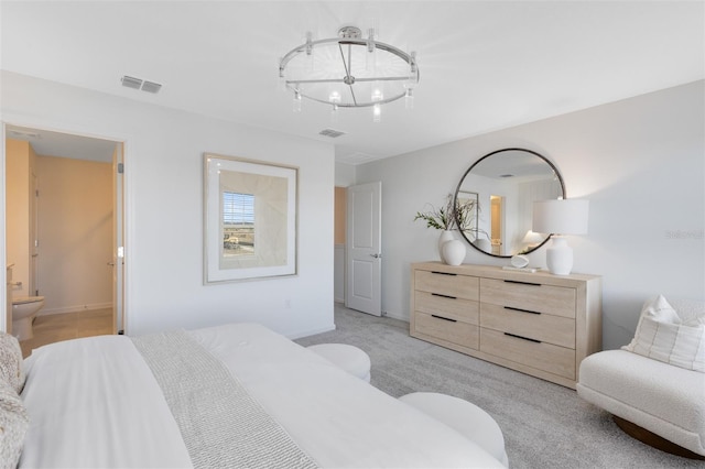 2304 Southbury Dr, Kissimmee, FL 34744 - bedroom with a chandelier, connected bathroom, and light colored carpet