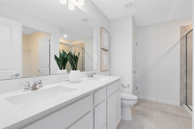 2304 Southbury Dr, Kissimmee, FL 34744 - bathroom with a stall shower, double vanity, and tile patterned flooring