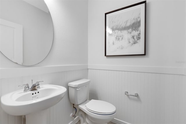 2304 Southbury Dr, Kissimmee, FL 34744 - bathroom with a wainscoted wall and a sink