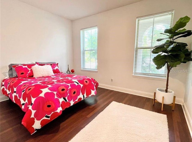 13542 Gorgona Isle Dr, Windermere, FL 34786 - bedroom featuring baseboards and wood finished floors