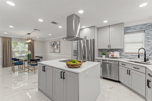 109 E 12th Ave, Windermere, FL 34786 - kitchen with appliances with stainless steel finishes, island range hood, gray cabinetry, a center island, and light marble finish flooring