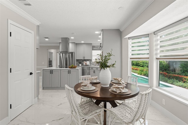 109 E 12th Ave, Windermere, FL 34786 - dining room featuring crown molding, light marble finish floors, healthy amount of natural light, and recessed lighting
