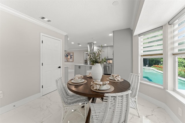 109 E 12th Ave, Windermere, FL 34786 - dining area featuring light marble finish floors, ornamental molding, healthy amount of natural light, a textured ceiling, and recessed lighting