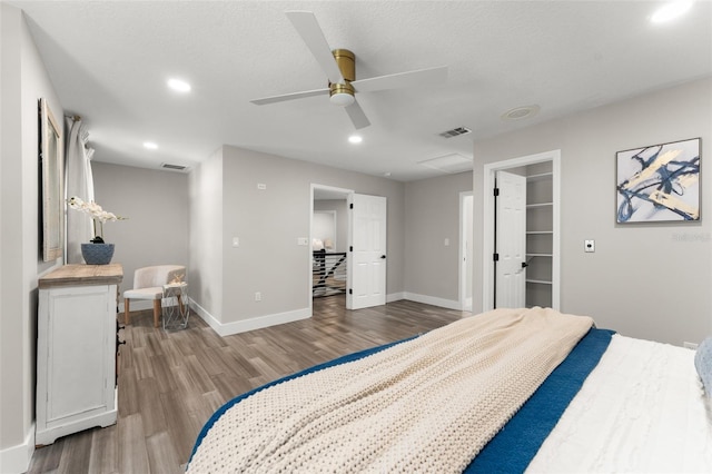 109 E 12th Ave, Windermere, FL 34786 - bedroom with wood finished floors, recessed lighting, a ceiling fan, and a spacious closet