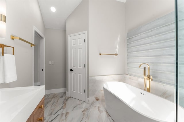 109 E 12th Ave, Windermere, FL 34786 - bathroom featuring a freestanding tub, marble finish floors, vanity, and recessed lighting