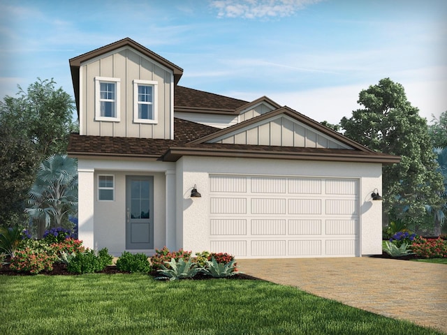 2288 Hen Rd, Minneola, FL 34715 - view of front of home with decorative driveway, an attached garage, board and batten siding, a shingled roof, and a front lawn