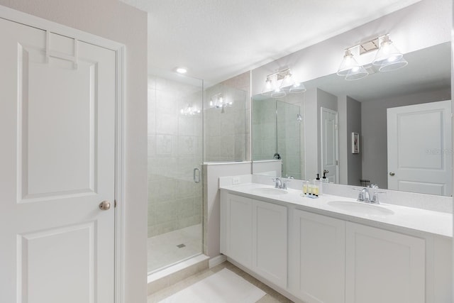 1030 Plantation Ln, Davenport, FL 33896 - full bathroom featuring a stall shower, double vanity, and tile patterned floors
