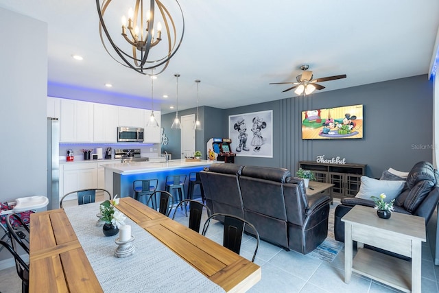 1030 Plantation Ln, Davenport, FL 33896 - dining area featuring light tile patterned flooring, ceiling fan, a chandelier, and recessed lighting