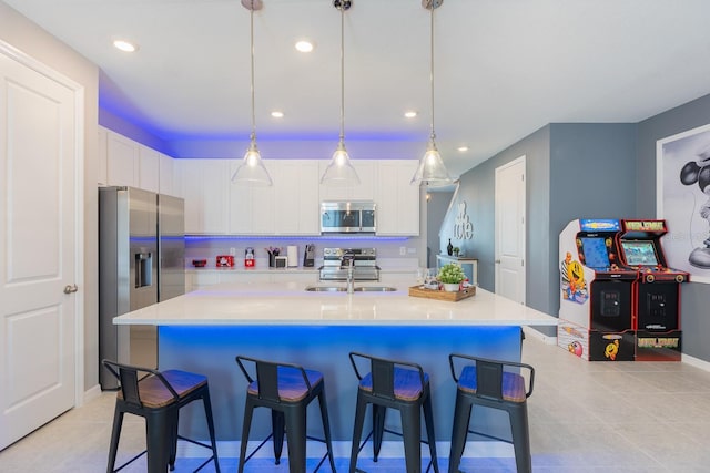 1030 Plantation Ln, Davenport, FL 33896 - kitchen with stainless steel appliances, white cabinets, light tile patterned floors, light countertops, and recessed lighting
