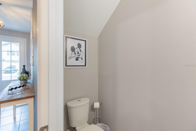 1030 Plantation Ln, Davenport, FL 33896 - bathroom with toilet and lofted ceiling