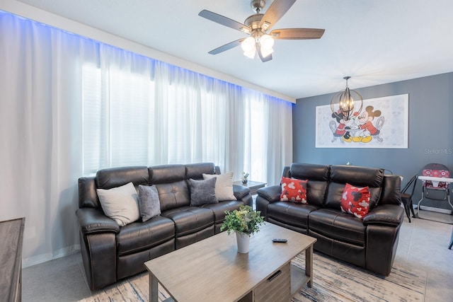 1030 Plantation Ln, Davenport, FL 33896 - living area with a chandelier, a ceiling fan, and light tile patterned floors