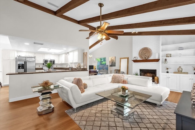 1157 E Winged Foot Cir, Winter Springs, FL 32708 - living room featuring a fireplace, light wood-style flooring, a ceiling fan, and recessed lighting