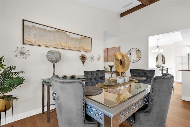 1157 E Winged Foot Cir, Winter Springs, FL 32708 - dining space with wood finished floors, beamed ceiling, and a chandelier