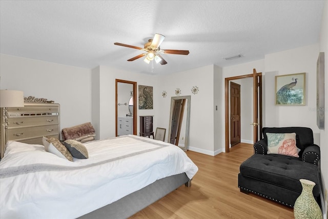 1157 E Winged Foot Cir, Winter Springs, FL 32708 - bedroom with light wood-style floors, ceiling fan, and a textured ceiling