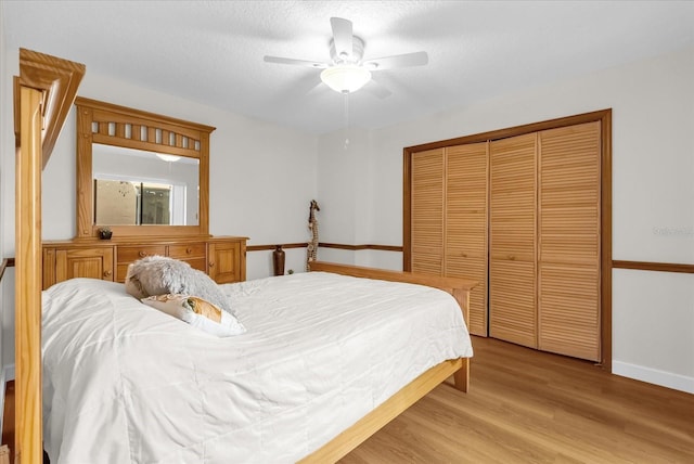 1157 E Winged Foot Cir, Winter Springs, FL 32708 - bedroom featuring light wood-style flooring, a closet, and a ceiling fan