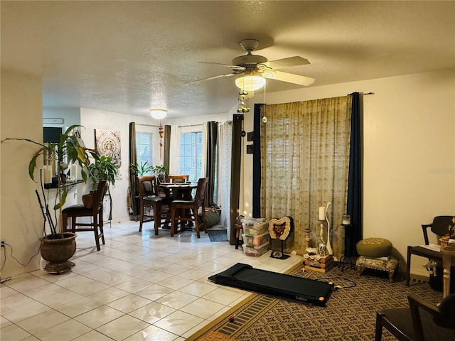 4690 Sussex Ter Unit 103, Orlando, FL 32811 - living area featuring ceiling fan and light tile patterned floors