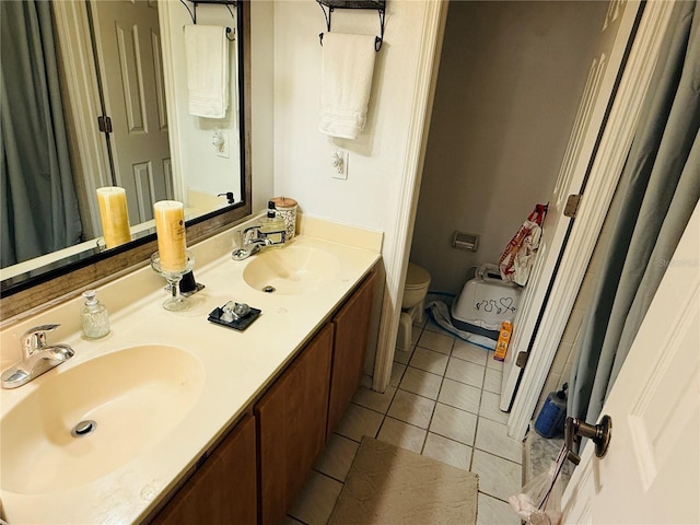 4690 Sussex Ter Unit 103, Orlando, FL 32811 - bathroom featuring tile patterned floors and double vanity