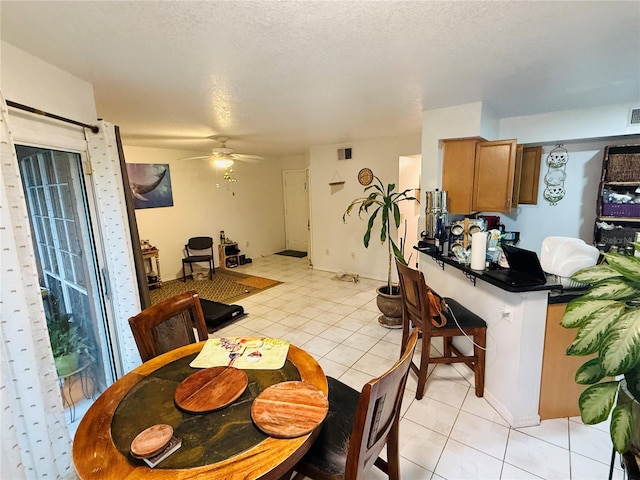 4690 Sussex Ter Unit 103, Orlando, FL 32811 - dining space featuring light tile patterned floors and ceiling fan