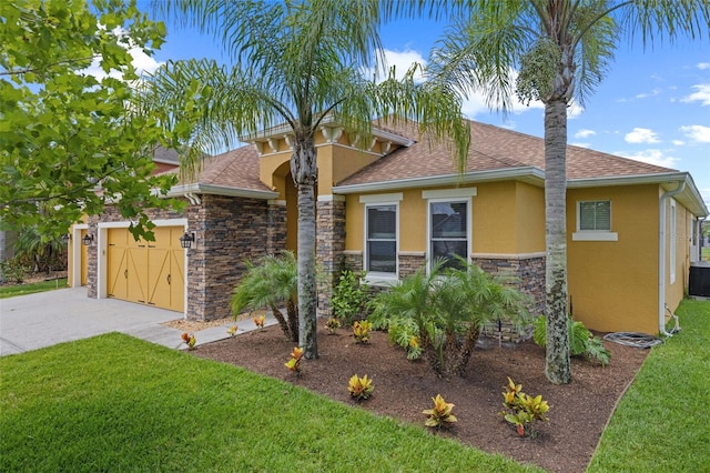 1758 Boat Launch Rd, Kissimmee, FL 34746 - view of front of property with stucco siding, concrete driveway, a front yard, an attached garage, and roof with shingles