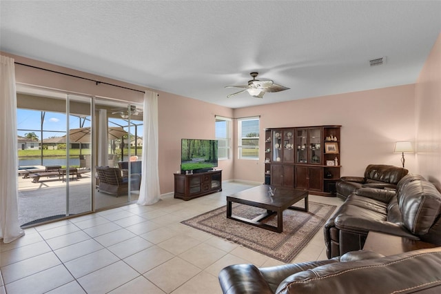 1758 Boat Launch Rd, Kissimmee, FL 34746 - living room with a ceiling fan and light tile patterned flooring