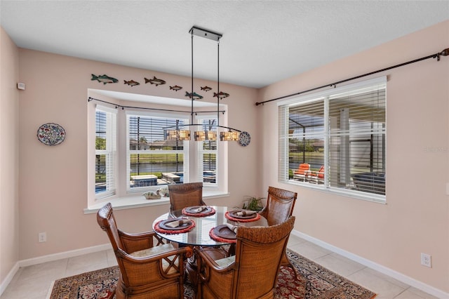 1758 Boat Launch Rd, Kissimmee, FL 34746 - dining room with light tile patterned floors and a textured ceiling