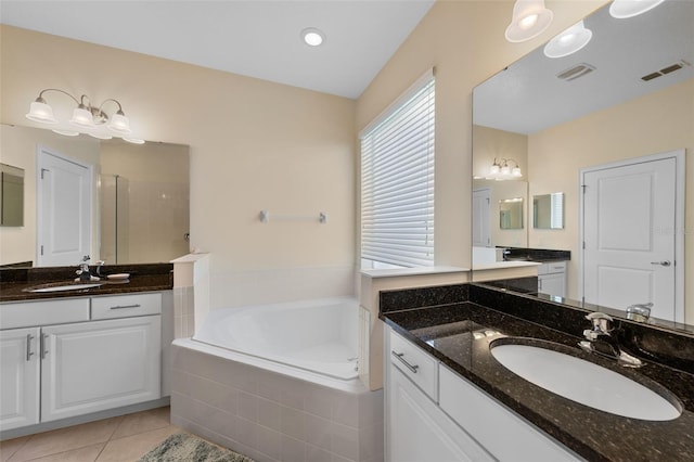 1758 Boat Launch Rd, Kissimmee, FL 34746 - bathroom with a garden tub, two vanities, a shower stall, and tile patterned flooring
