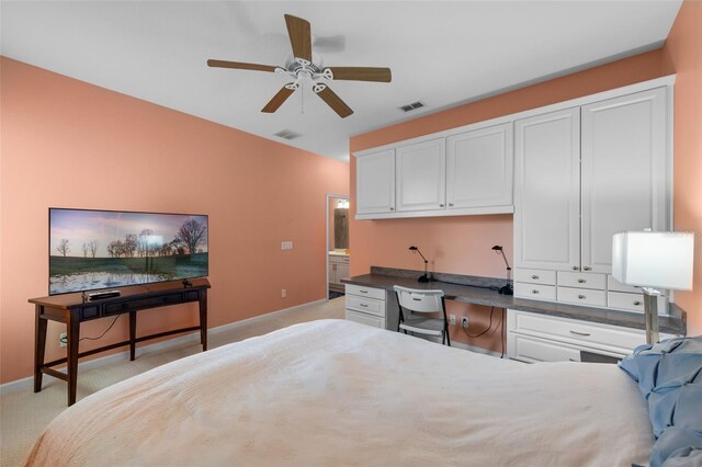 1758 Boat Launch Rd, Kissimmee, FL 34746 - bedroom with built in desk, light colored carpet, and a ceiling fan
