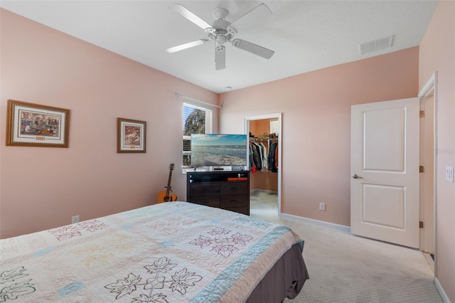 1758 Boat Launch Rd, Kissimmee, FL 34746 - bedroom with a spacious closet, light carpet, and a ceiling fan
