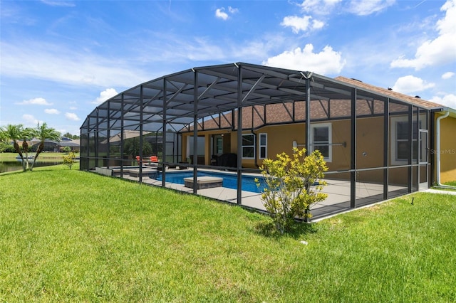 1758 Boat Launch Rd, Kissimmee, FL 34746 - rear view of house featuring a yard, an outdoor pool, a patio, and a lanai