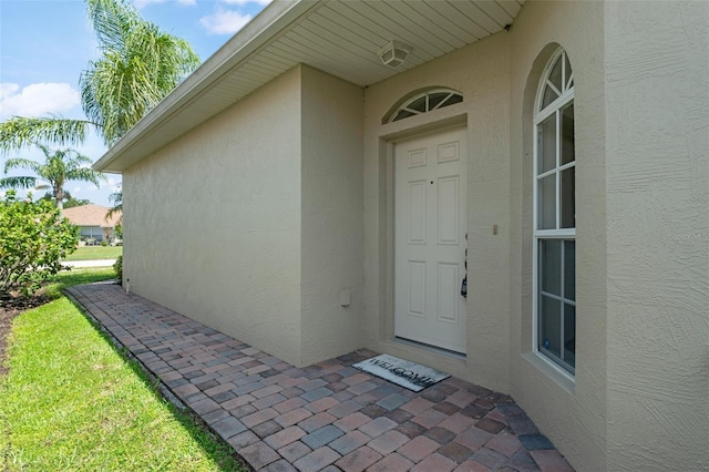 1218 Vienna Square Dr, Winter Haven, FL 33884 - property entrance featuring stucco siding