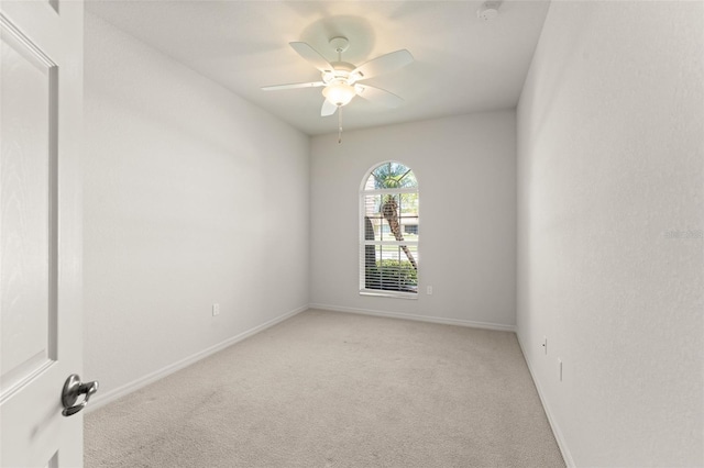 1218 Vienna Square Dr, Winter Haven, FL 33884 - unfurnished room with light colored carpet, a ceiling fan, and a smoke detector